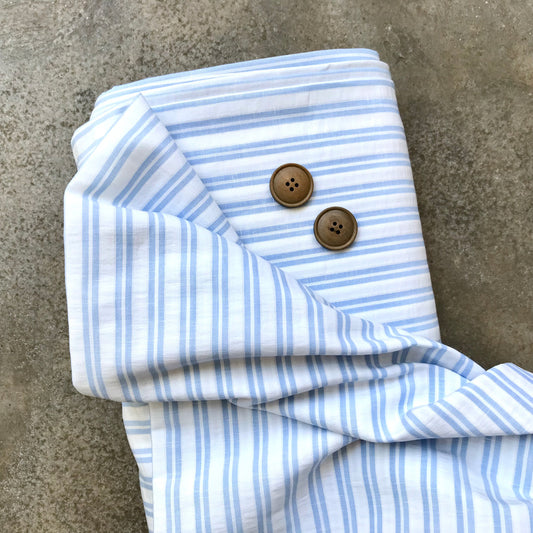 Cortijo: a light blue and white striped fabric