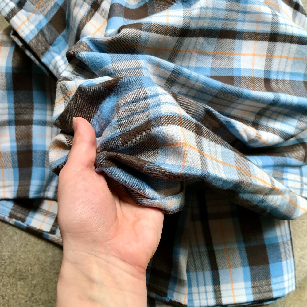 plaid fabric with blue, brown, and white colors