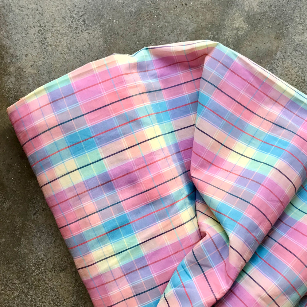 Madras 6730816 - Pastel plaid fabric on a concrete surface