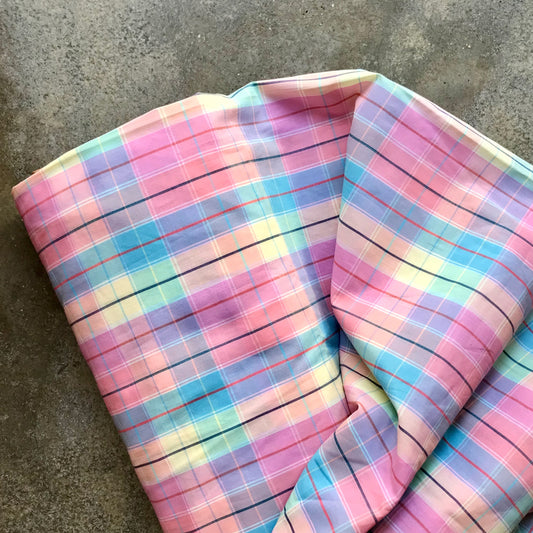 Madras 6730816 - Pastel plaid fabric on a concrete surface