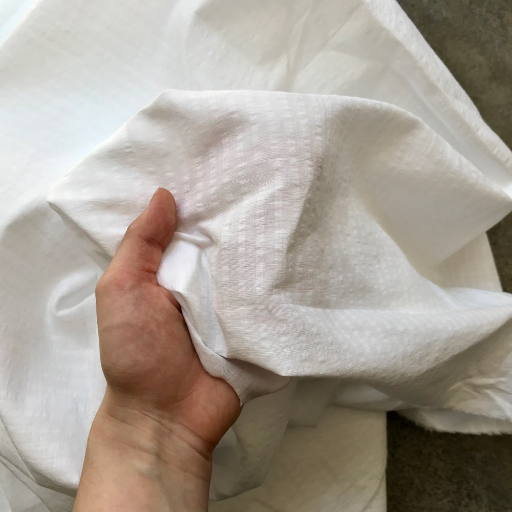 Benahavis: A folded piece of white fabric