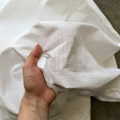 Benahavis: A folded piece of white fabric