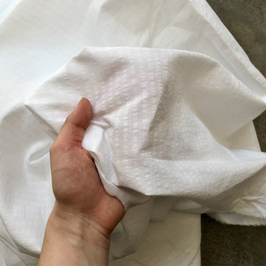 Benahavis: A folded piece of white fabric