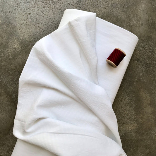 Benahavis: A folded piece of white fabric