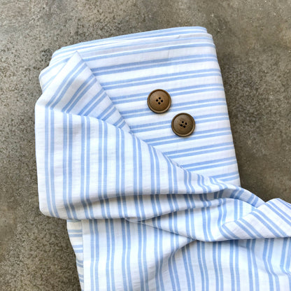 Cortijo: a light blue and white striped fabric