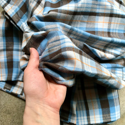 plaid fabric with blue, brown, and white colors