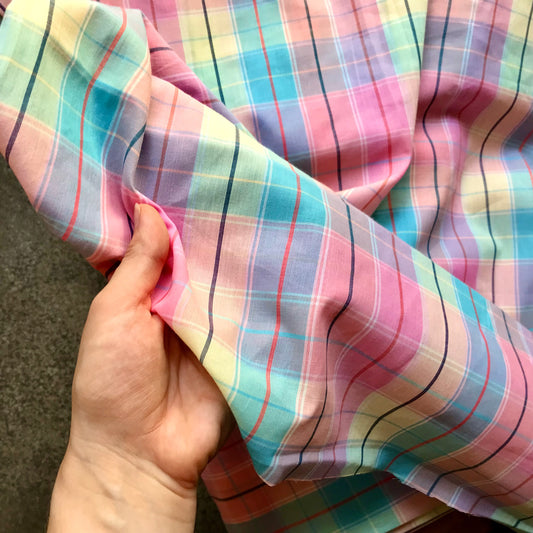 Madras 6730816 - Pastel plaid fabric on a concrete surface