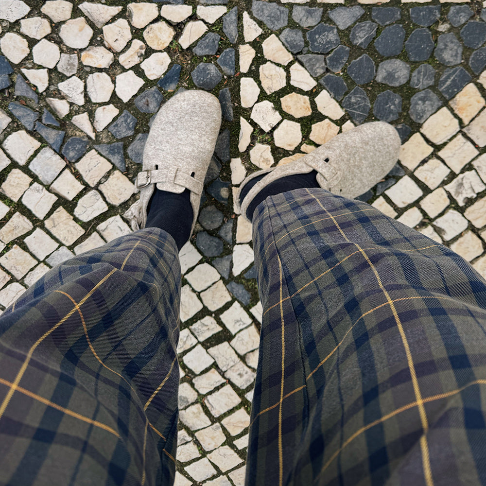 Person wearing wool felt clogs / sandals in Lisbon, Portugal